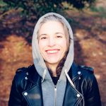 woman smiling near tree - A retiree enjoying early retirement in the UK, exploring strategies for financial independence and lifestyle planning.