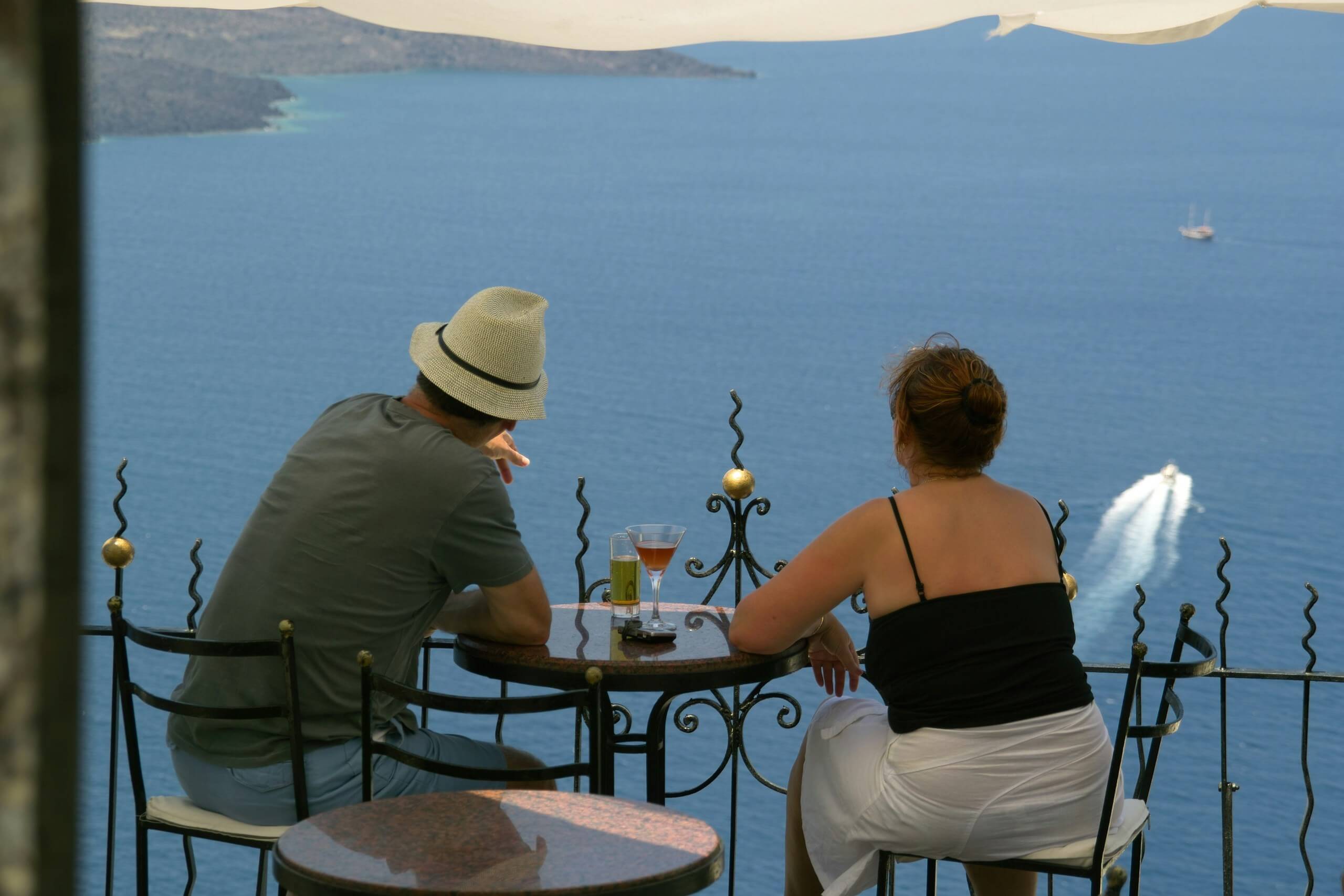 A couple planning for early retirement in the UK, reviewing financial documents and setting goals