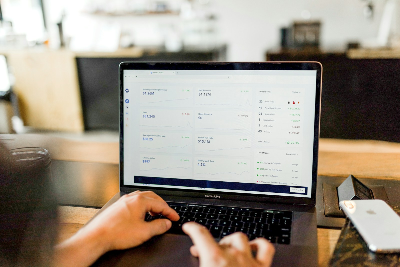 person using MacBook pro - A retiree exploring passive income options to supplement their pension during retirement